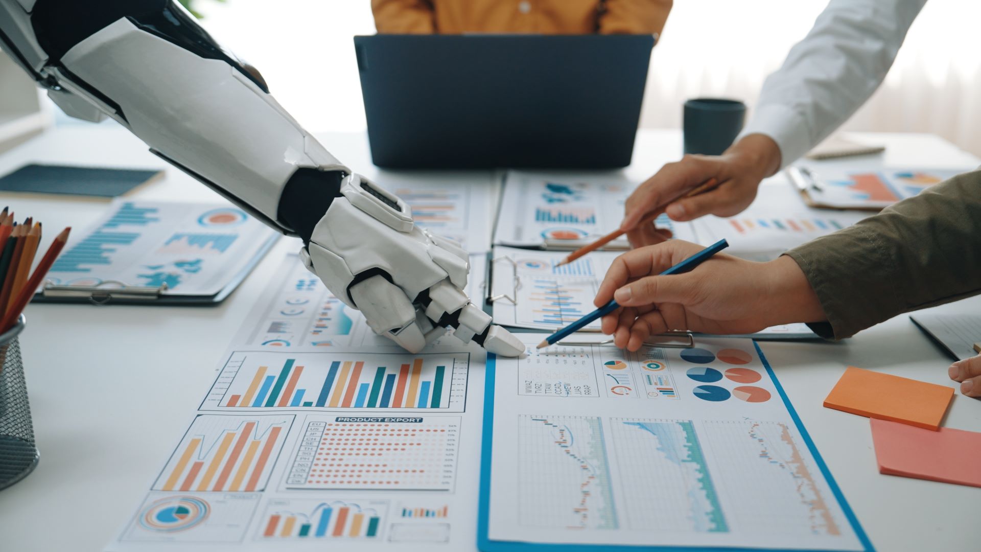 Robot arm and people analyzing data charts and diagrams in an onlyfans agency